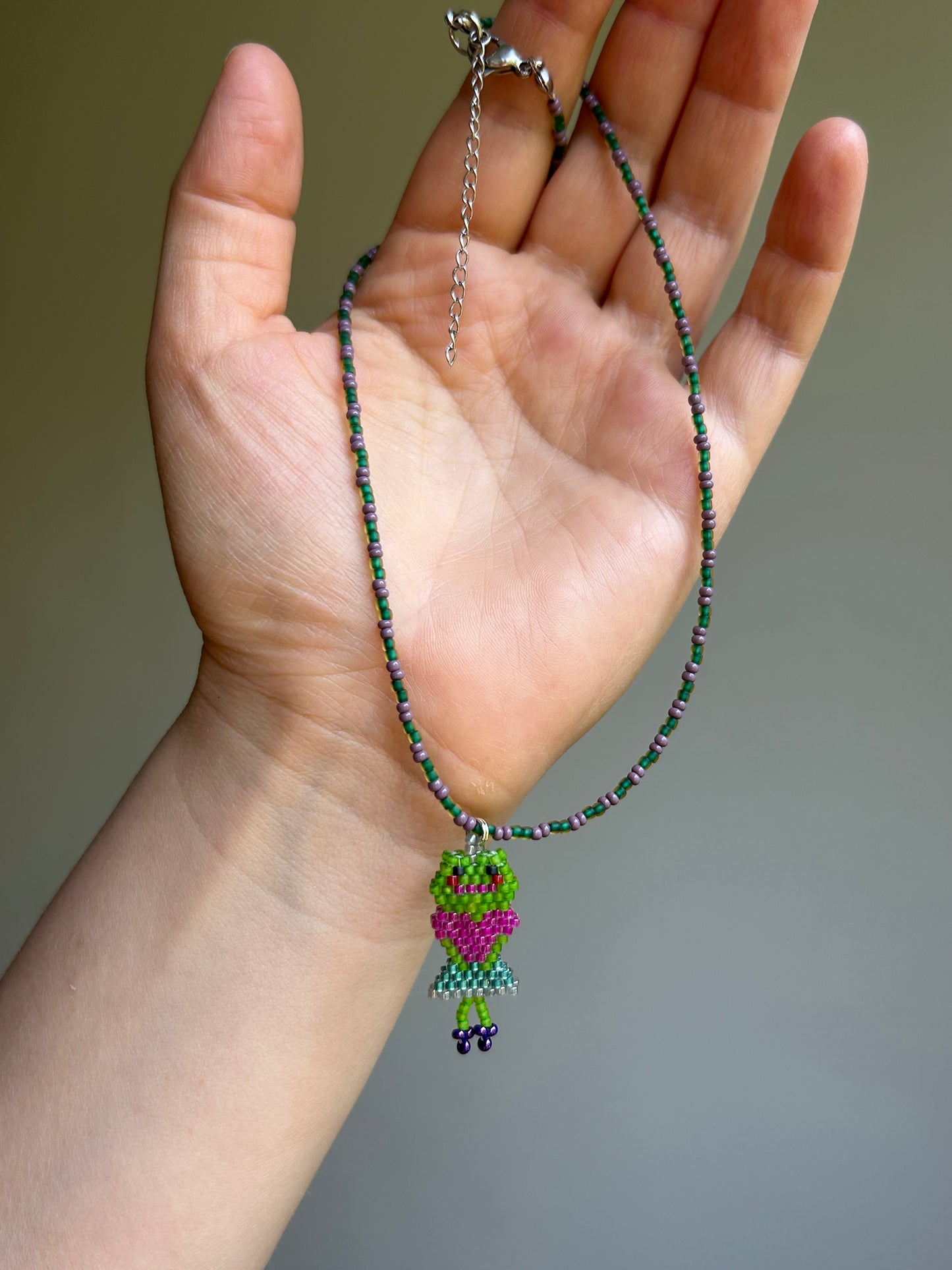 Beaded necklace with a frog
