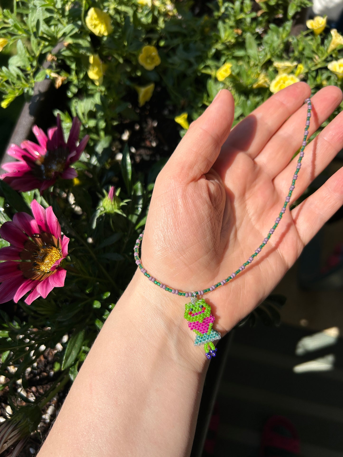 Beaded necklace with a frog