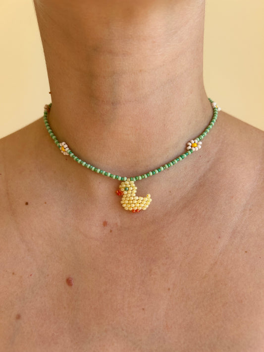 A little duck among the daisies