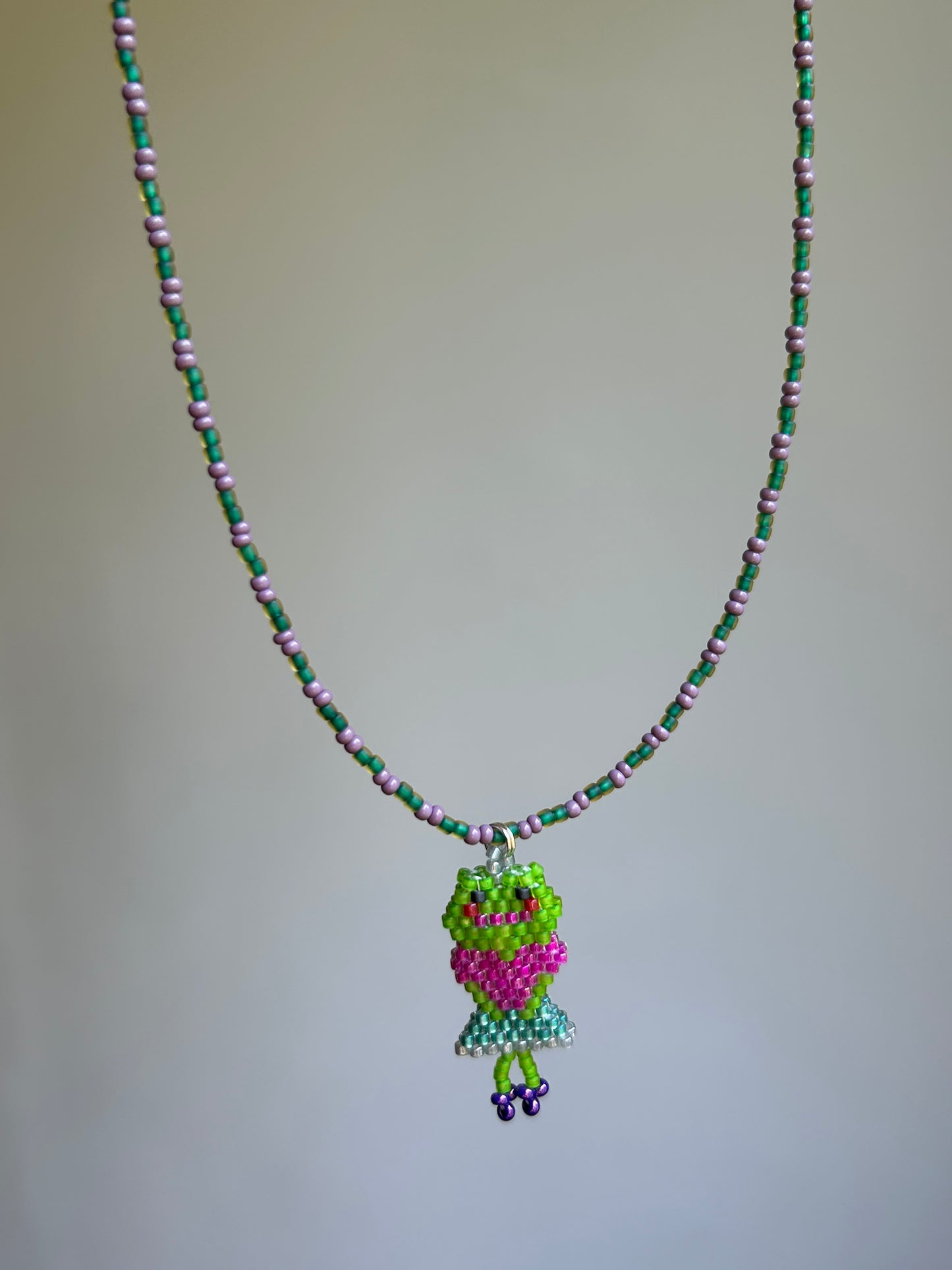 Beaded necklace with a frog