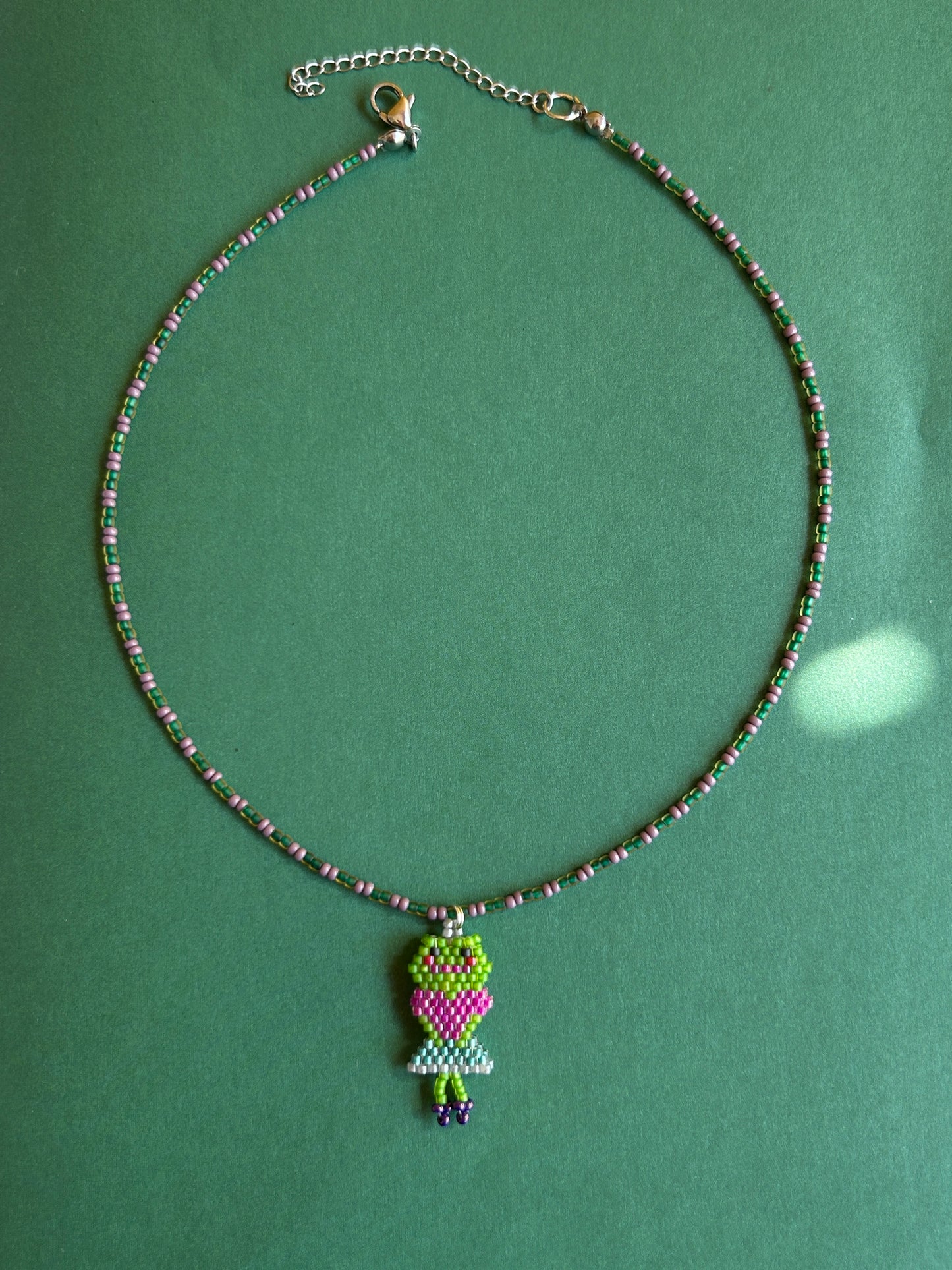 Beaded necklace with a frog