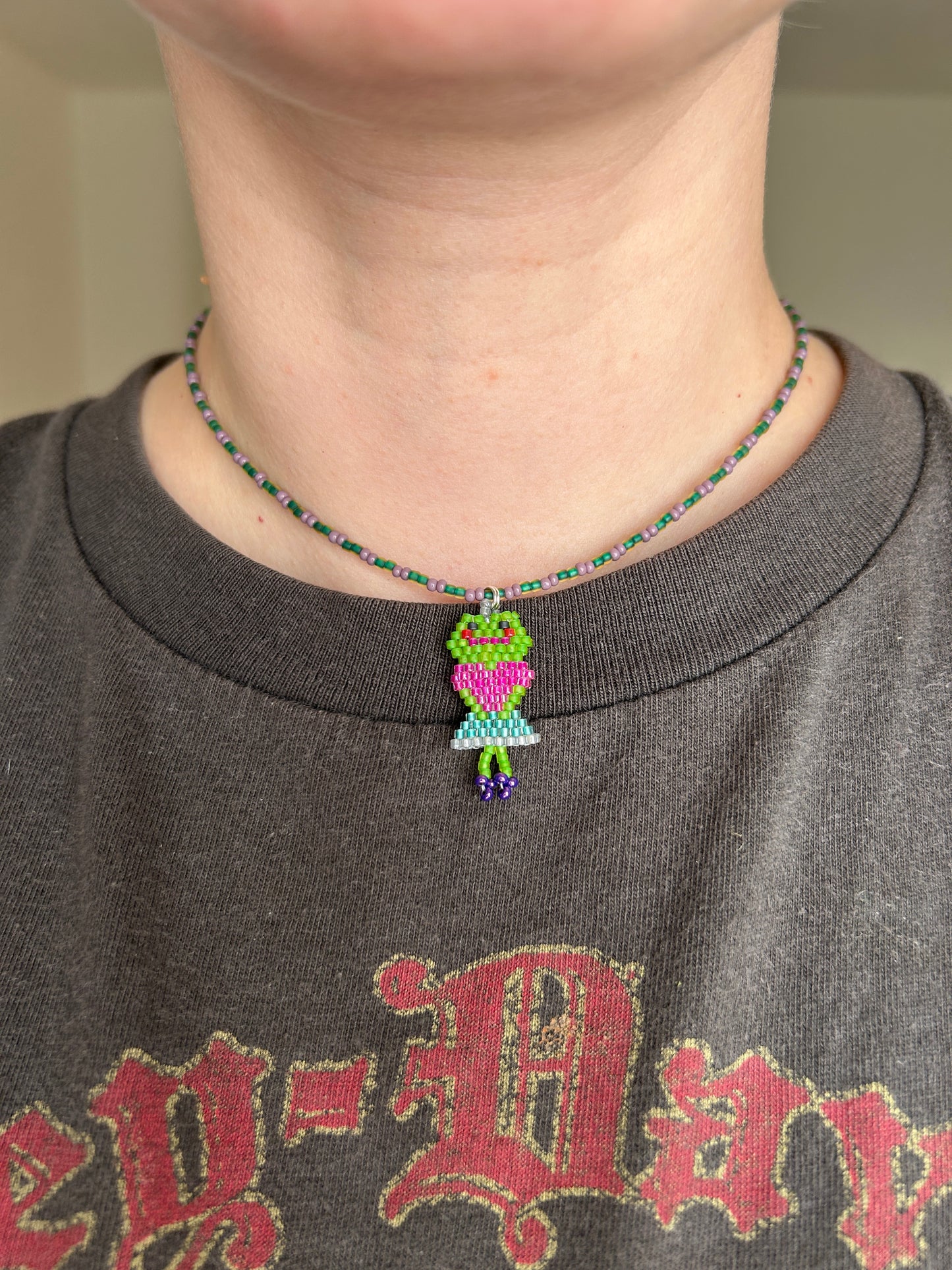 Beaded necklace with a frog