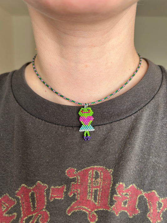 Beaded necklace with a frog