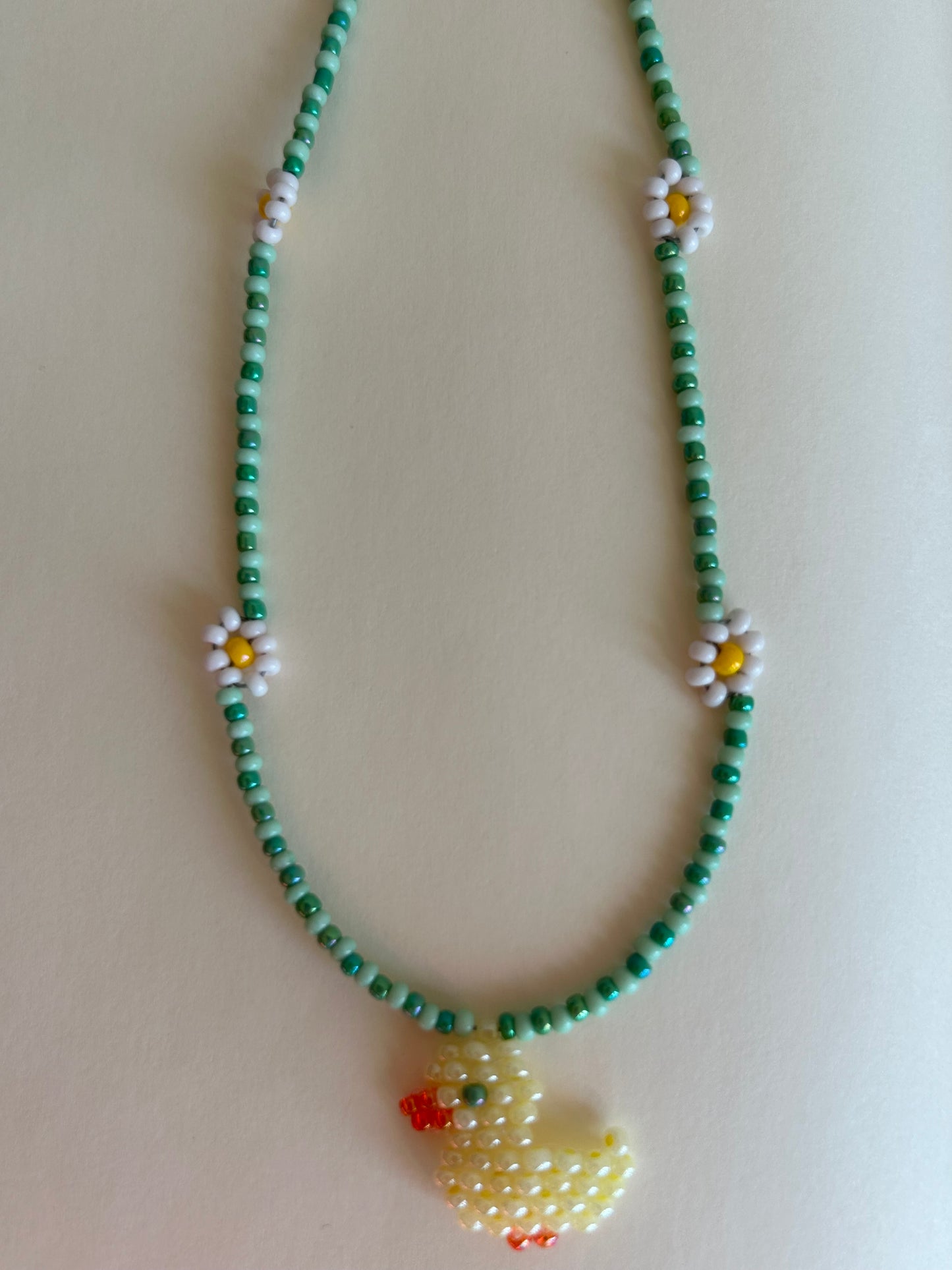 A little duck among the daisies